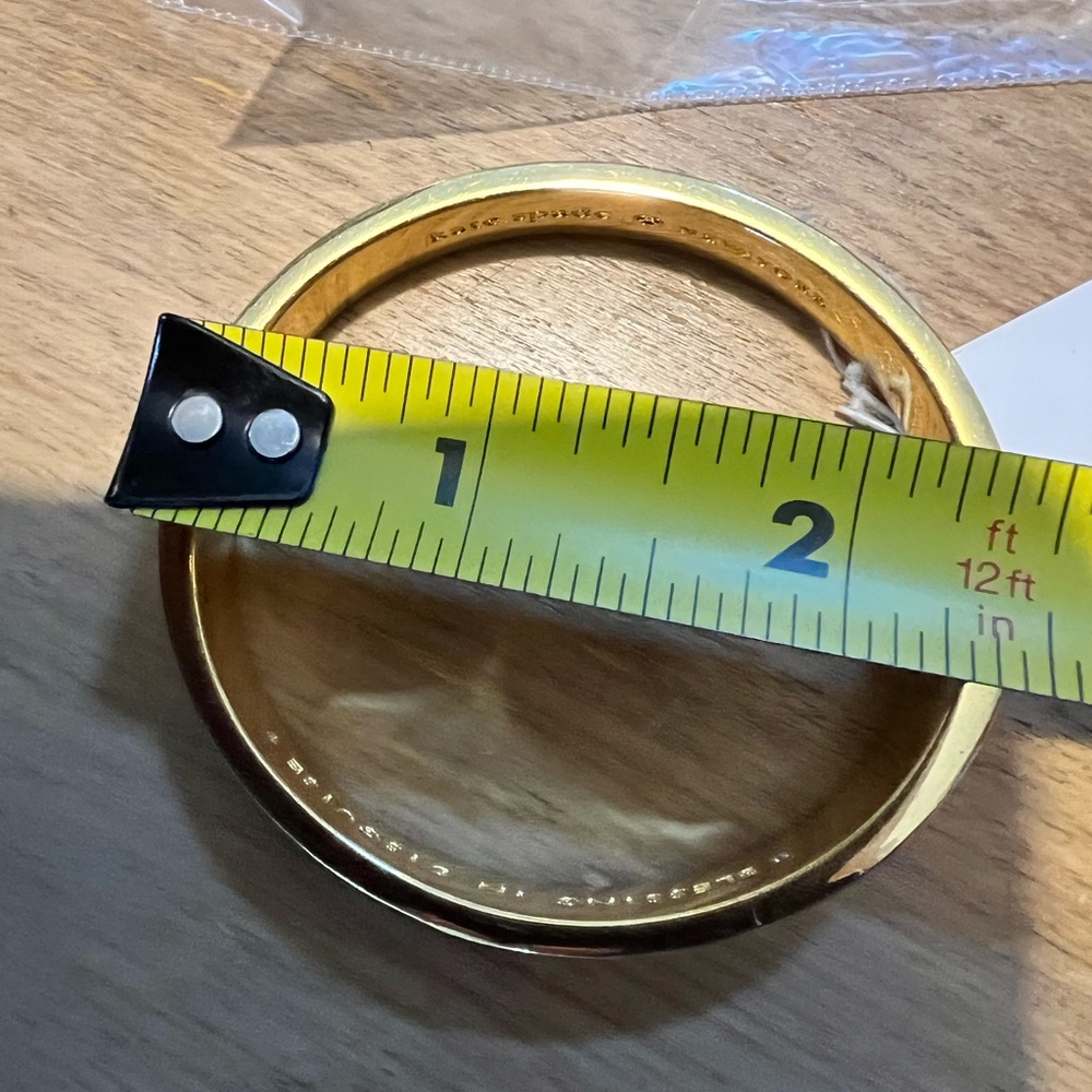 Kate Spade New York gold tone hinged bangle. “Blessing in Disguise” inside. - Picture 11 of 11